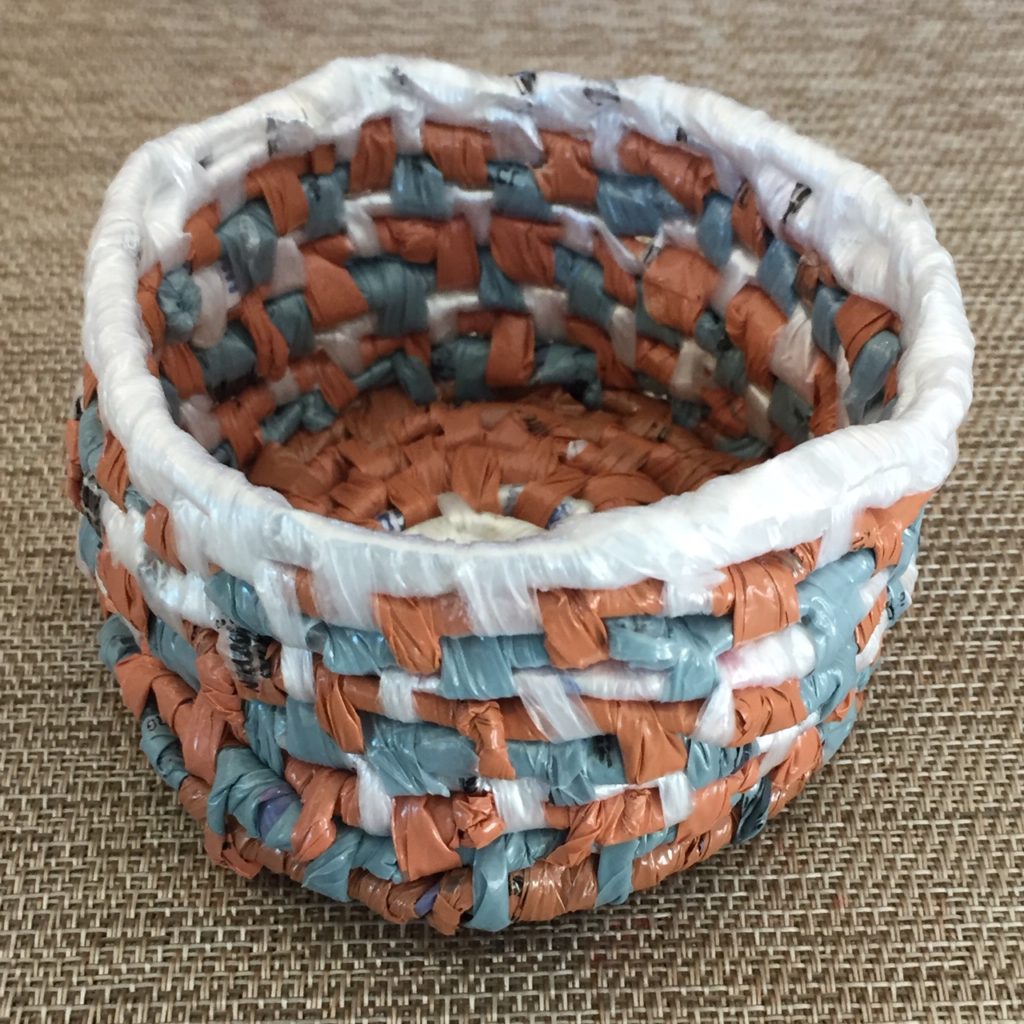 small coil basket in white, blue and terra cotta