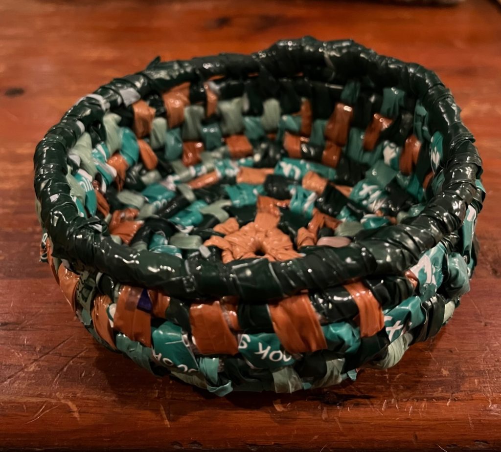 small coil basket in green and browns