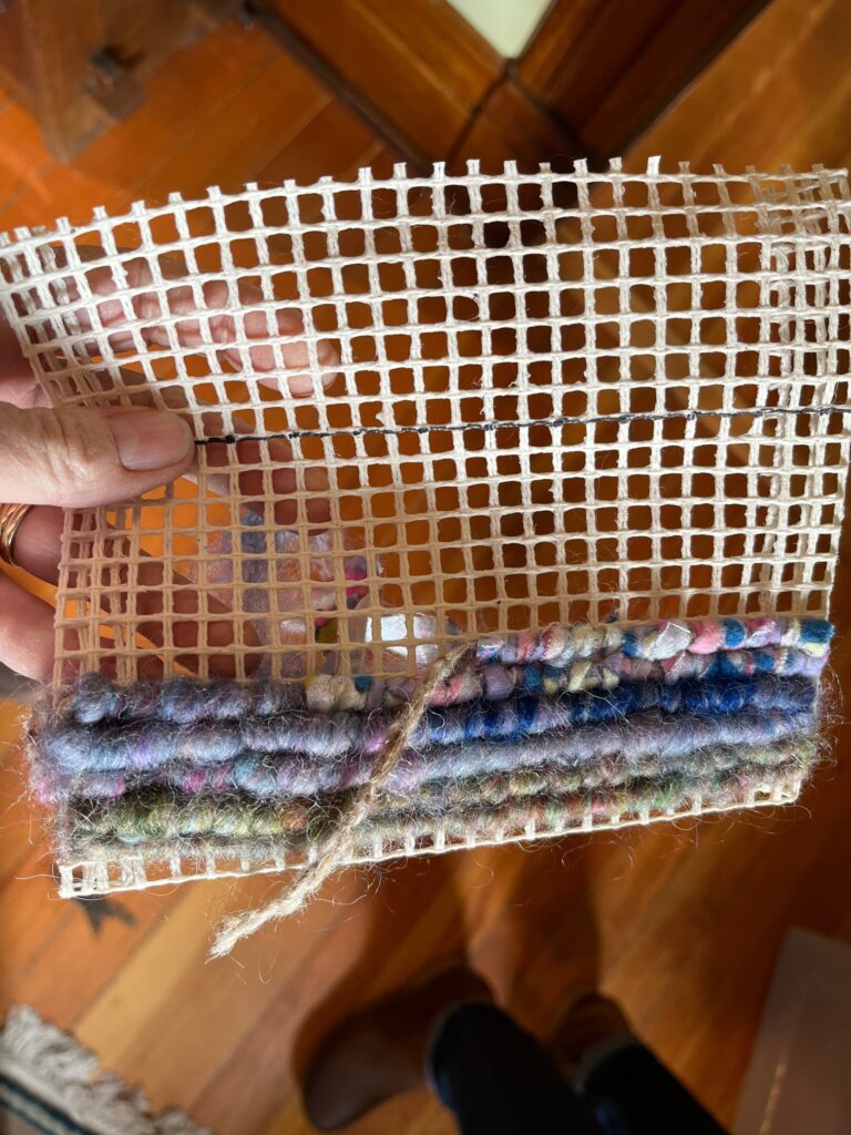 Sample of locker hooking with twine and multi colored wool