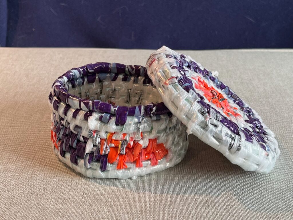 Lidded basket in purple, orange and white