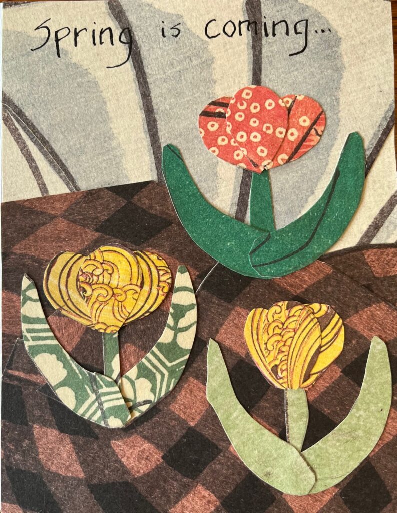 Card with three flowers on plaid ground